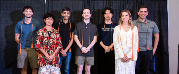 7 students with orange cords 