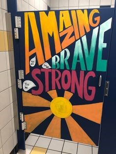 Amazing Brave Strong & Sun on a bathroom stall door
