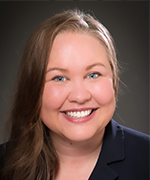 Woman with brown hair smiling