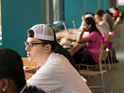 Students sitting at desks studying