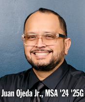Juan wearing glasses and black button up with tie