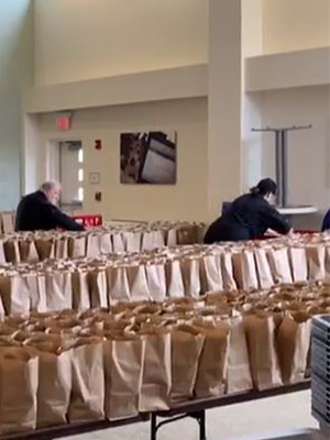 Rows of brown lunchbags lined up for assembly