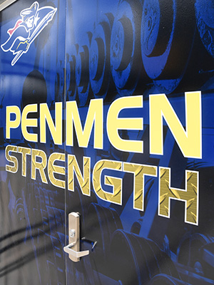 Doors that have "Penmen Strength" and SNHU athletic logo on them